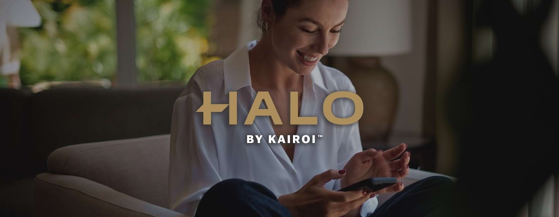 a woman smiling and interacting with her device