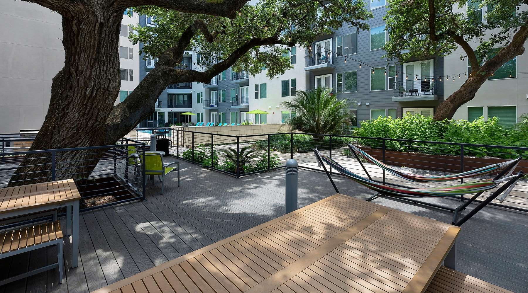 Large courtyard with hammocks adjacent to the swimming pool 