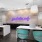 Large well lit leasing office with neon sign 