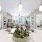 Spacious and well lit kitchen with wood flooring and stainless steel appliances