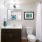 Large well lit bathroom with white accents 